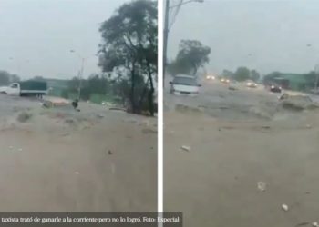 #VIDEO Taxista quiere ganarle a la corriente de agua en Monterrey sin éxito