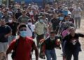 Bloquean caravana migrante, deportan a más de 2 mil personas