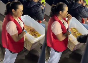VIDEO: ¡No se comió solo una! Vendedora de palomitas disfruta partido de Liga MX